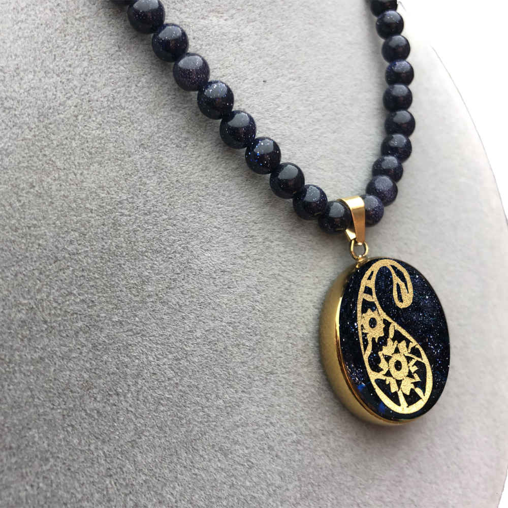 قلادة إيرانية مطلية بالذهب بوتيه جغه