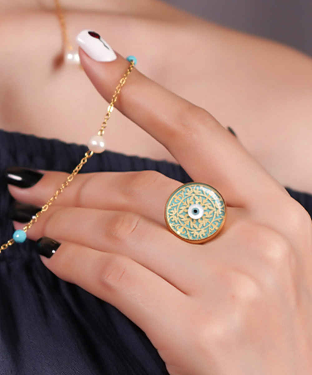 خاتم التوقيع من الفولاذ المطلي بالذهب مع طبقة من الراتنج التركواز ورمز العين الشريرة