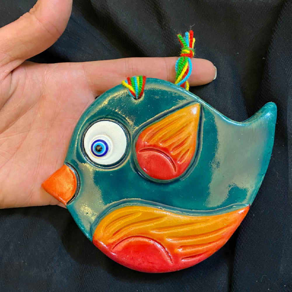 عمل فني معلق على الحائط موديل الطائر