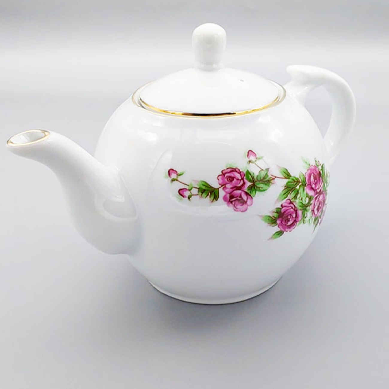 إبريق شاي من البورسلين بتصميم زهور باللون الأبيض